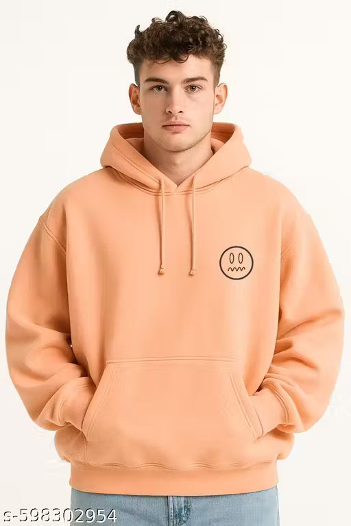 Man wearing a peach hoodie with a logo on a white background
