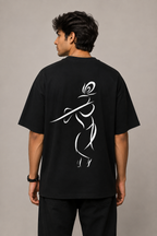 Back view of model wearing black MĀDHAVA T-shirt featuring large Krishna line-art artwork