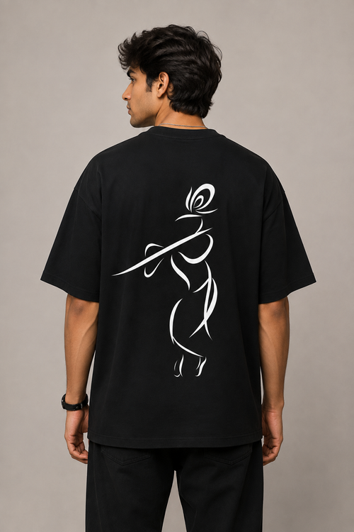 Back view of model wearing black MĀDHAVA T-shirt featuring large Krishna line-art artwork