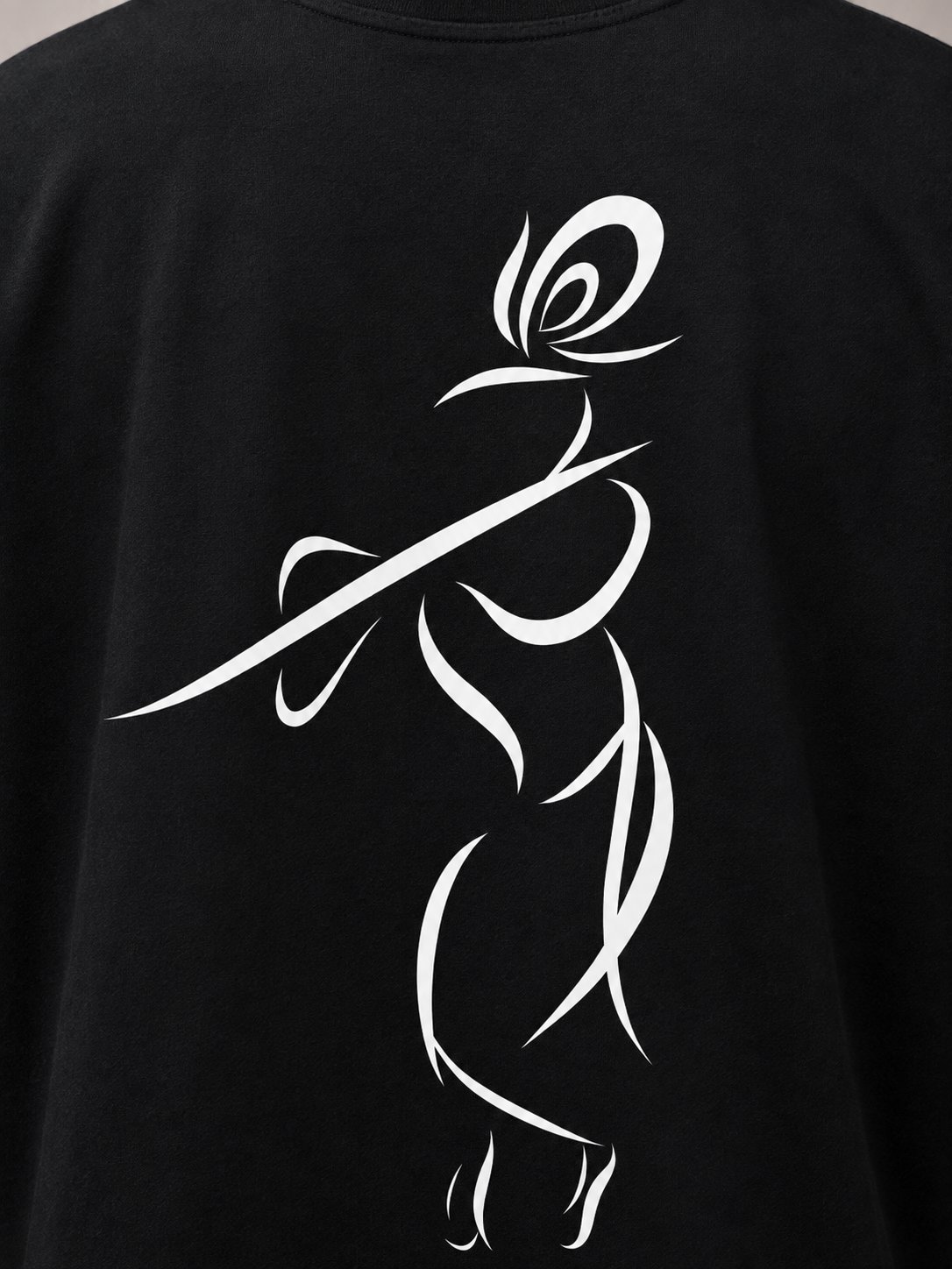 Close-up of Krishna line-art back print on premium black cotton T-shirt
