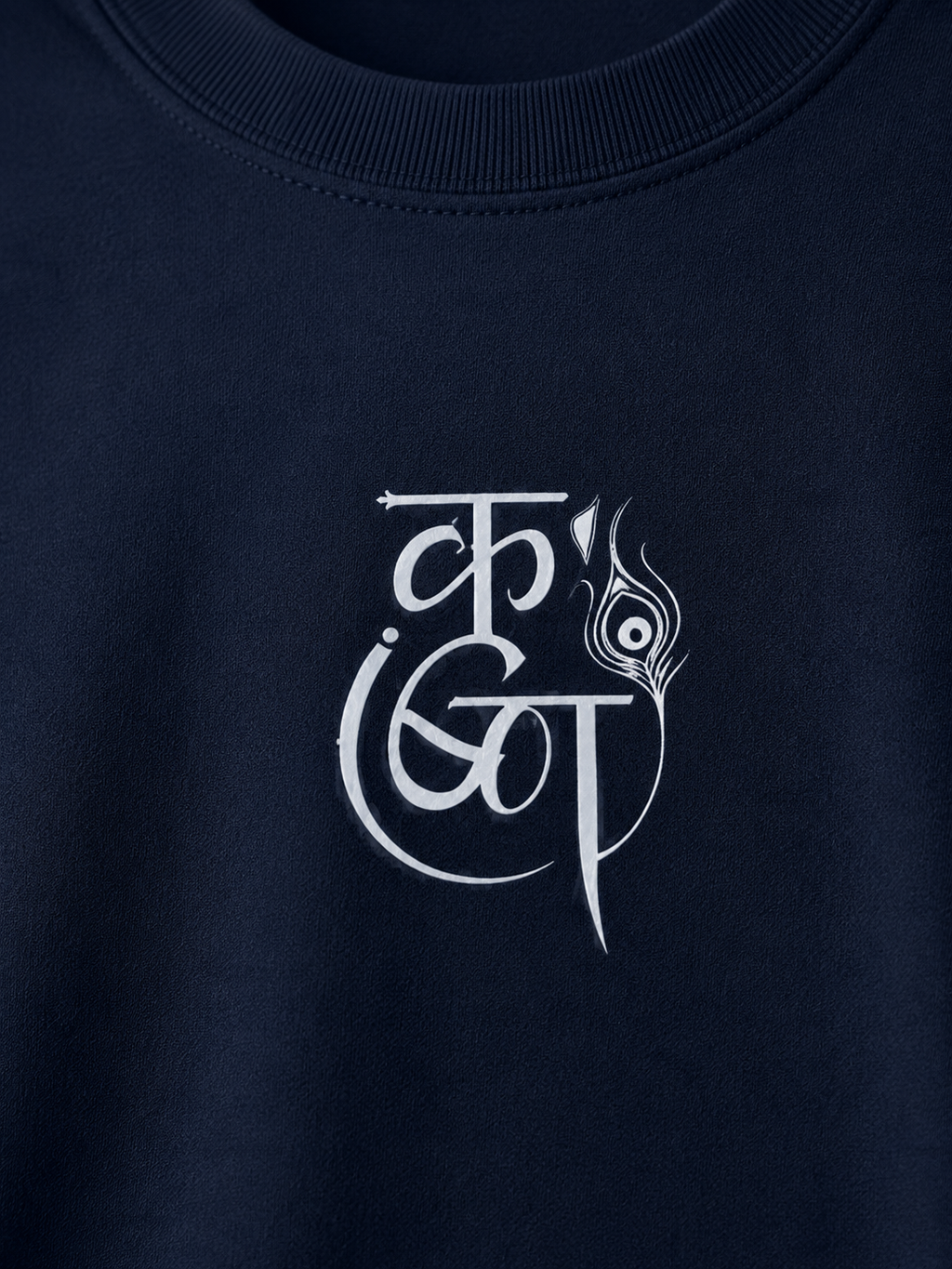 Close-up of a navy blue crewneck sweatshirt featuring a white stylized graphic print on the chest.