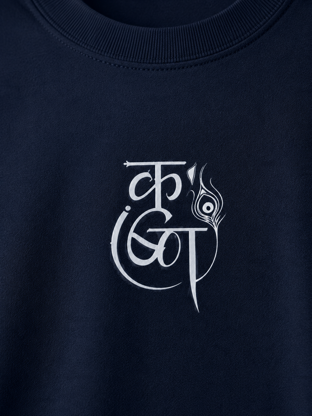 Close-up of a navy blue crewneck sweatshirt featuring a white stylized graphic print on the chest.