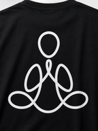 Close-up of a black T-shirt with a large white minimalist line-art graphic on the front, showing part of the neckline and the upper torso.