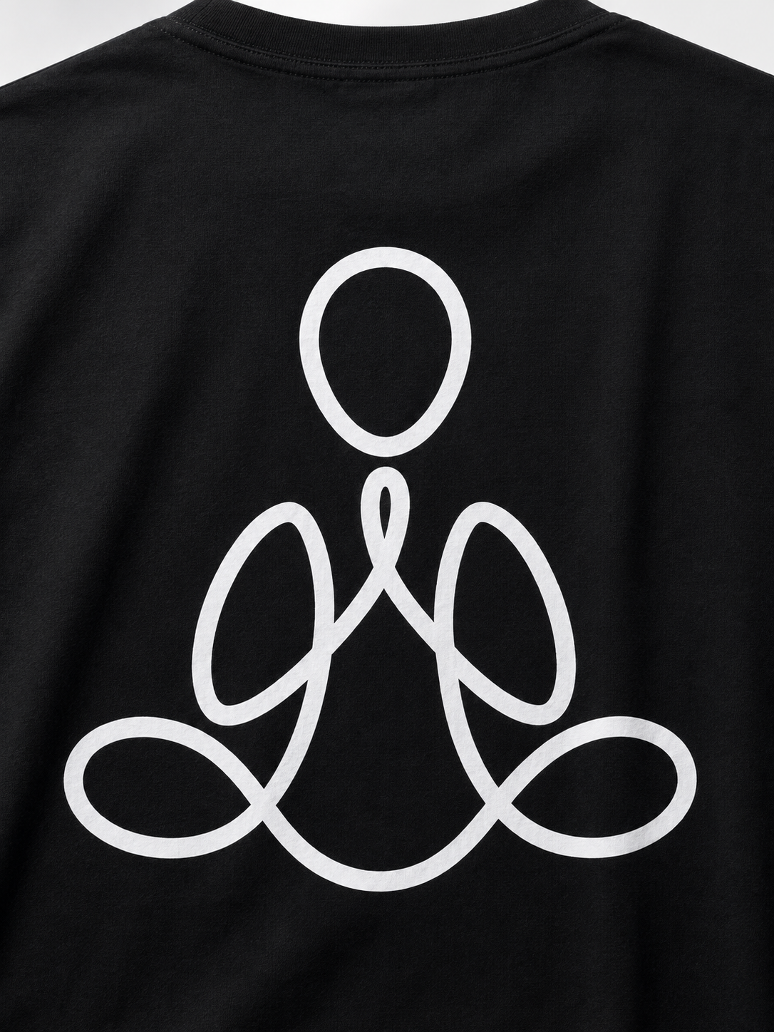Close-up of a black T-shirt with a large white minimalist line-art graphic on the front, showing part of the neckline and the upper torso.