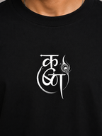 Close-up of minimalist Krishna-inspired chest print on black premium cotton T-shirt