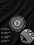 Close-up of a black T-shirt fabric showing a large white circular Om symbol print with decorative border details, plus marketing text and a circular inset highlighting the printed texture.