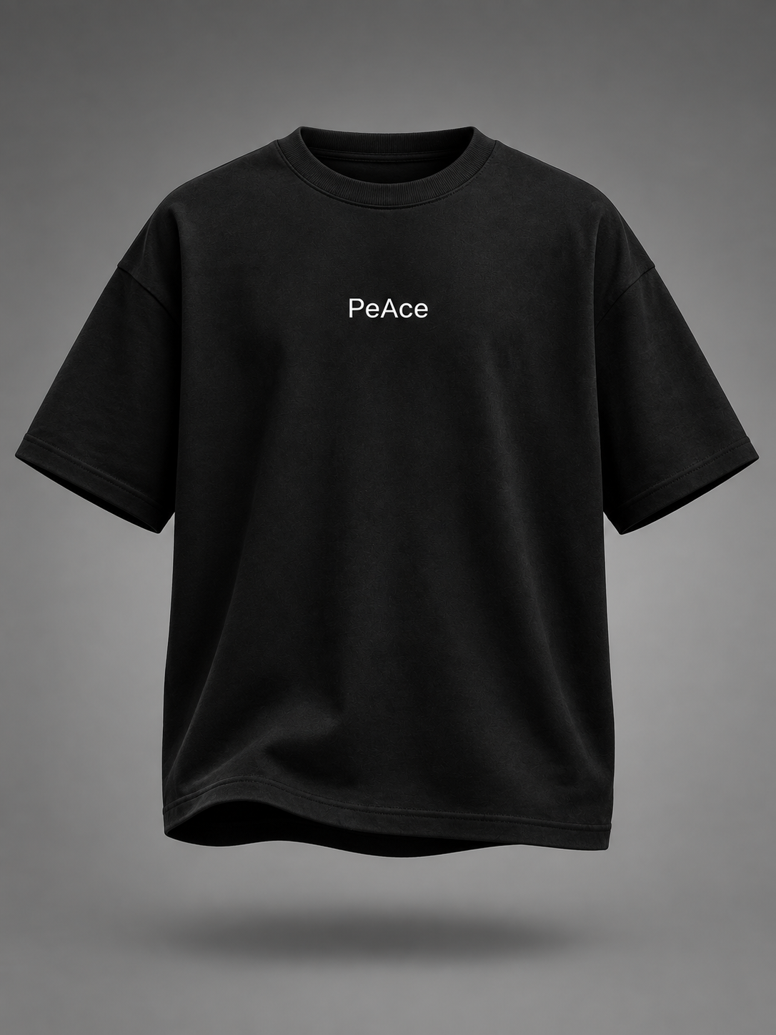 A black short-sleeve crewneck t-shirt with the word 'PeAce' printed in white on the chest, shown against a dark gray gradient background.