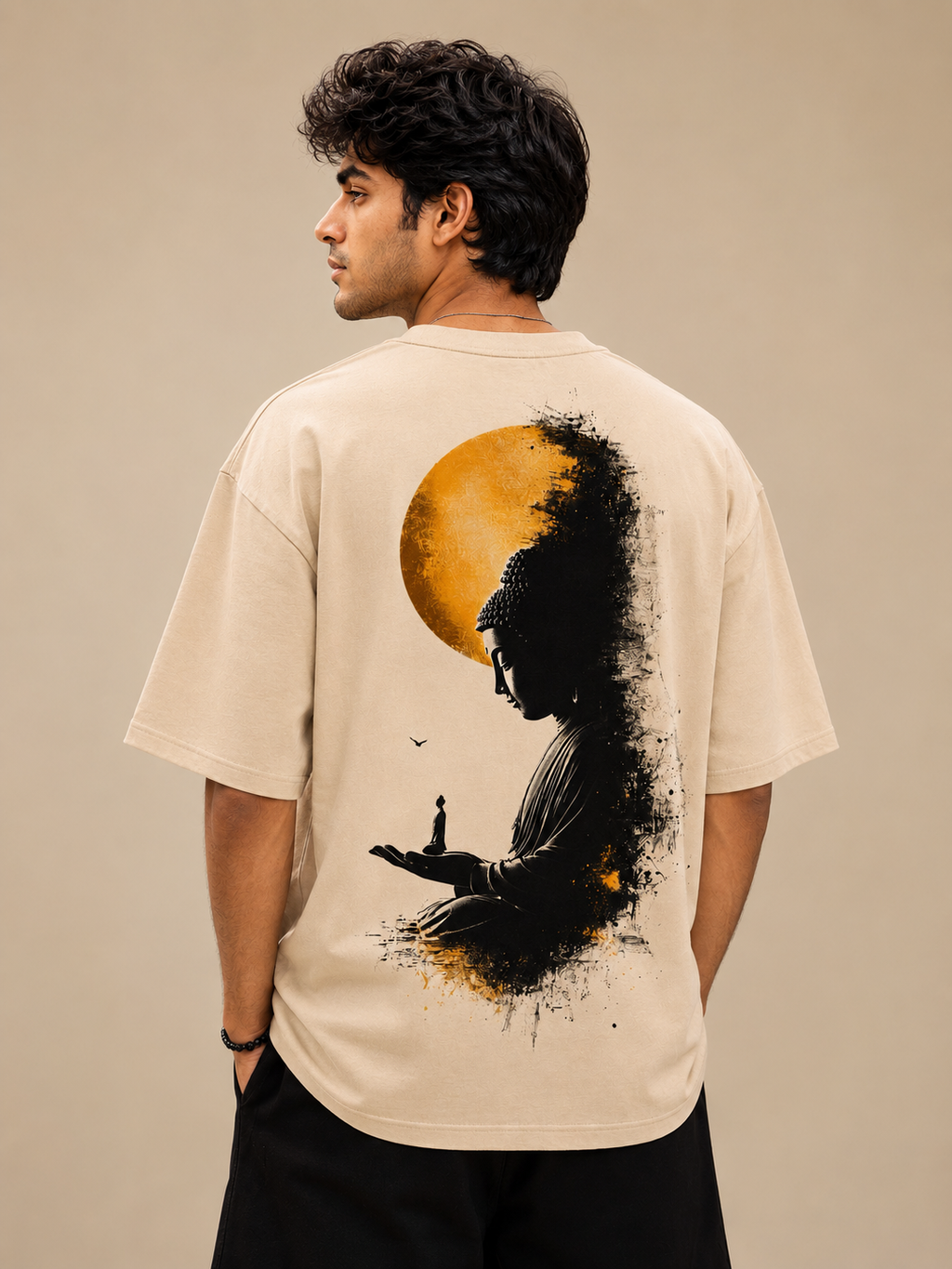 Male model wearing beige NIRVANA Buddha T-shirt with minimal lotus-inspired chest design