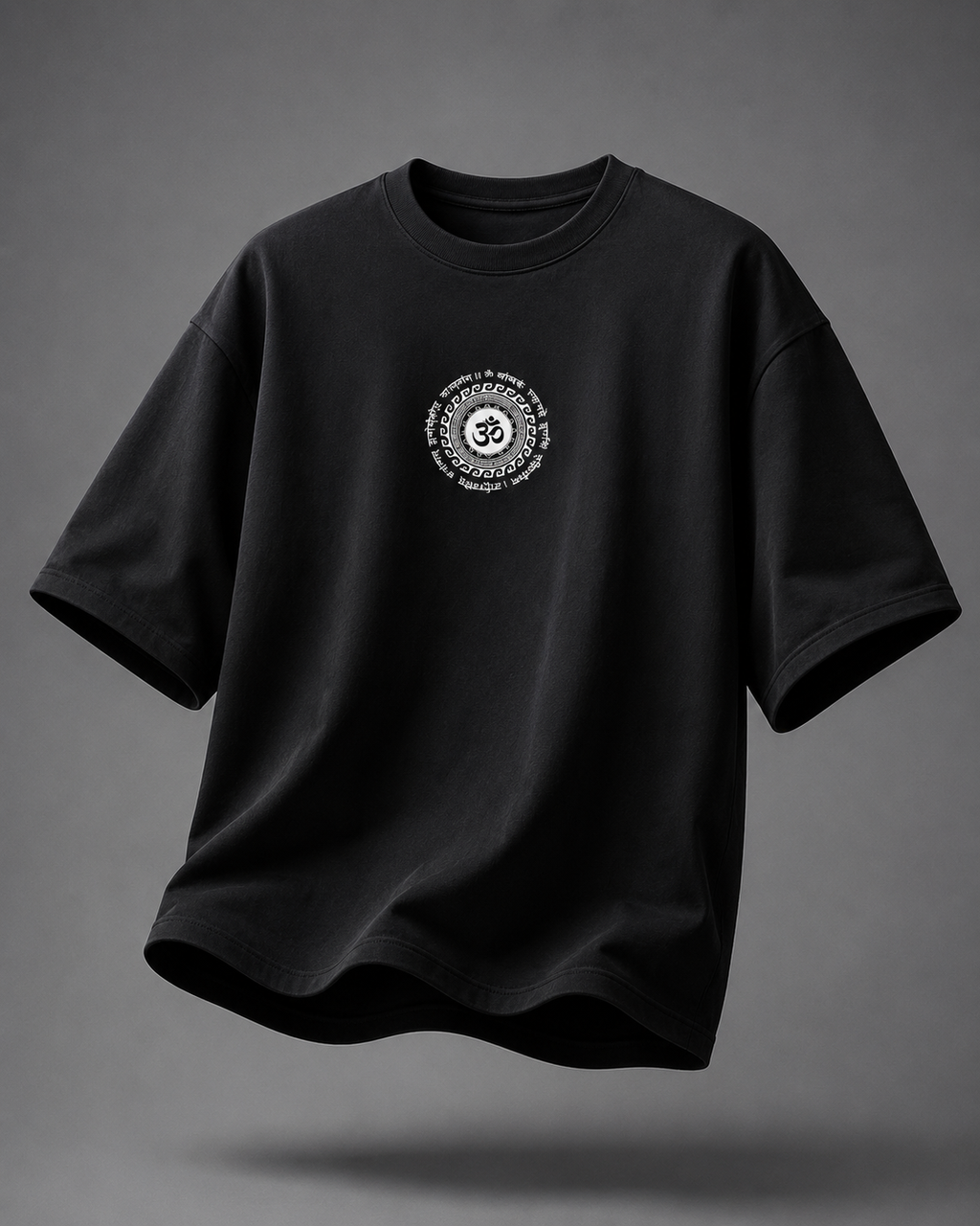A black short-sleeve crewneck t-shirt with a circular white graphic printed on the center chest, shown floating against a dark gray gradient background.