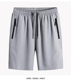 Gray loose casual pants with zippers on a white background