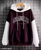 Black and white hoodie with 'Los Angeles California' text on a tiled wall background