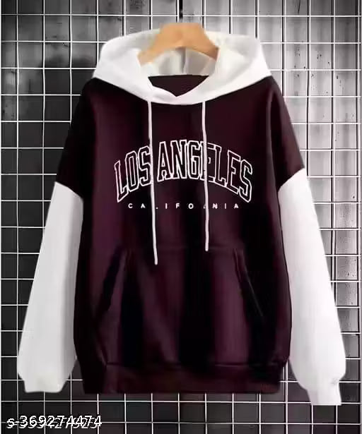 Black and white hoodie with 'Los Angeles California' text on a tiled wall background
