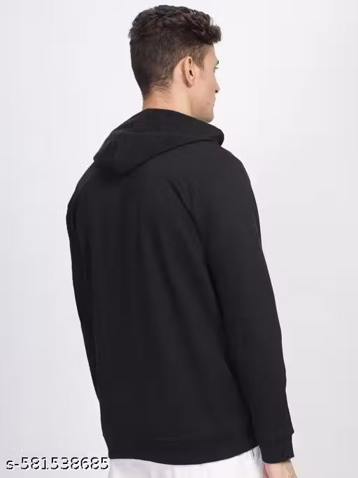 Person wearing a black hoodie from behind on a white background